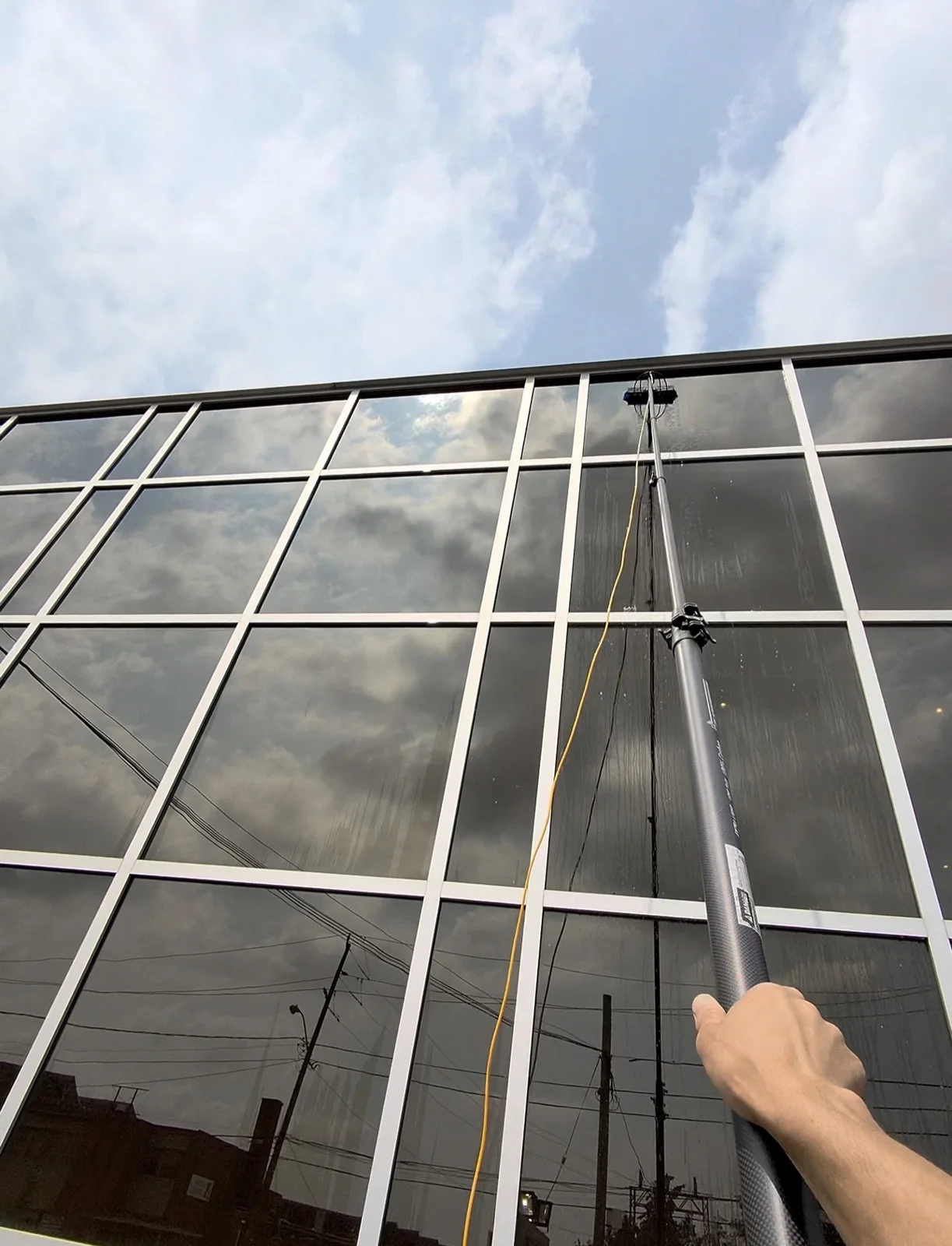 NOVAWASH washing exterior windows with a water-fed pole